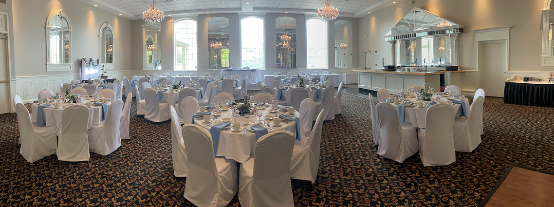 The King Room banquet hall decorated with white and blue linens