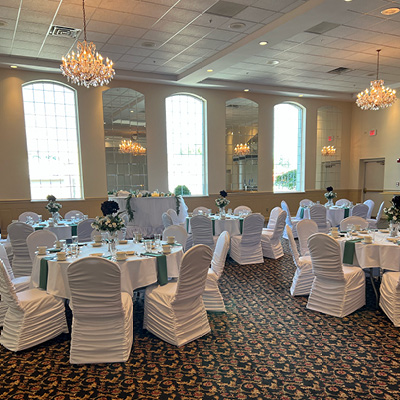 Banquet hall with green and white linens